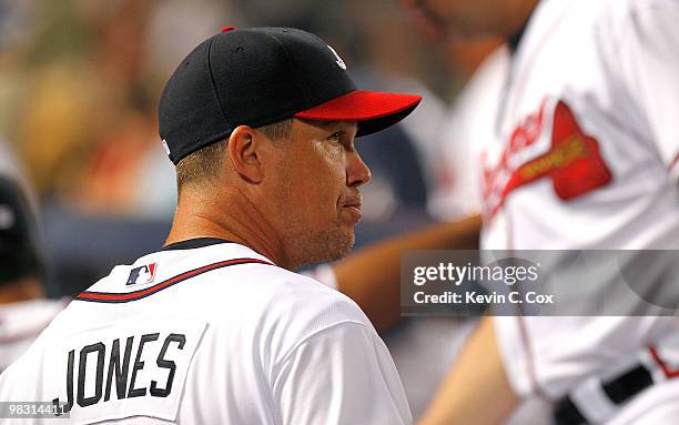 Chipper Jones of the Atlanta Braves watches the stats on the jumbotron after their 3-2 win over the Chicago Cubs at Turner Field on April 7, 2010 in...