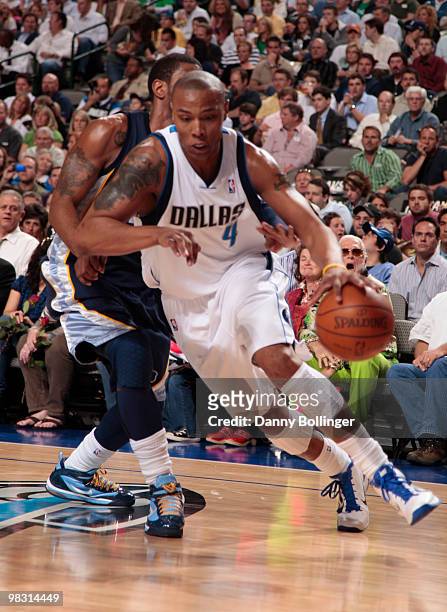 Caron Butler of the Dallas Mavericks drives against O.J. Mayo of the Memphis Grizzlies during a game at the American Airlines Center on April 7, 2010...
