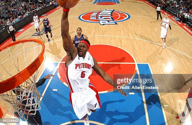 Ben Wallace of the Detroit Pistons goes up for a dunk past Josh Smith of the Atlanta Hawks in a game at the Palace of Auburn Hills on April 7, 2010...