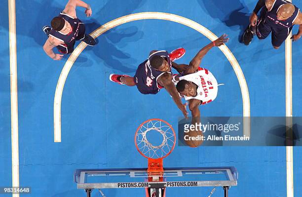 Will Bynum of the Detroit Pistons goes up for a reverse layup past Marvin Williams of the Atlanta Hawks in a game at the Palace of Auburn Hills on...
