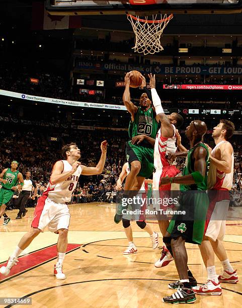 Ray Allen of the Boston Celtics attempts the layup against Sonny Weems and Joses Calderon of the Toronto Raptors during a game on April 7, 2010 at...