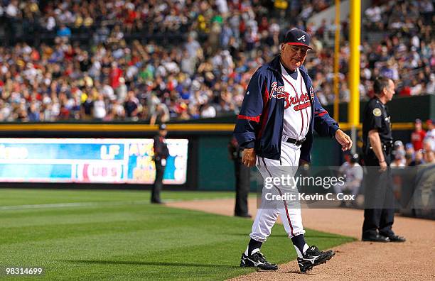 Manager Bobby Cox of the Atlanta Braves walks back to the dugout after arguing a call during the game against the Chicago Cubs at Turner Field on...