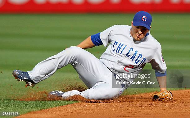 Ryan Theriot of the Chicago Cubs fields a ball against the Atlanta Braves at Turner Field on April 7, 2010 in Atlanta, Georgia.