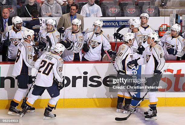 Shea Weber of the Nashville Predators celebrates with teammates after scoring a first period goal against the Phoenix Coyotes during the NHL game at...