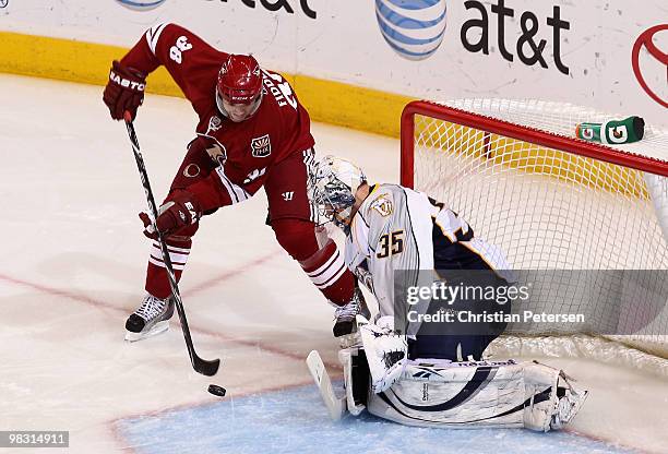 Vernon Fiddler of the Phoenix Coyotes attempts a shot on goaltender Pekka Rinne of the Nashville Predators during the first period of the NHL game at...