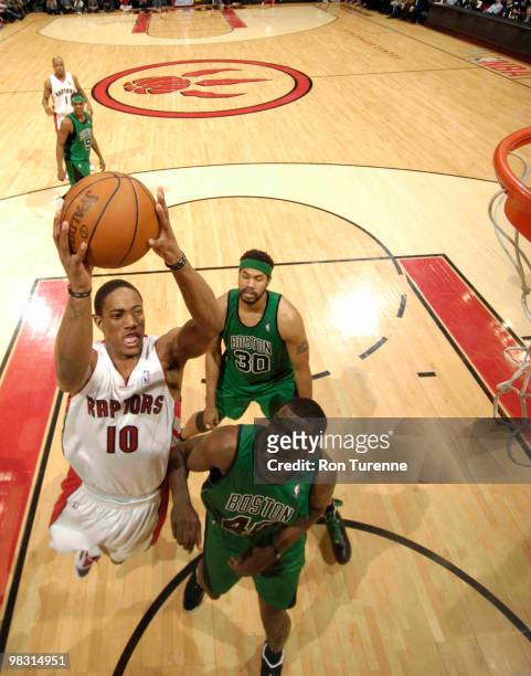 DeMar DeRozan of the Toronto Raptors gets to the rim against Michael Finley of the Boston Celtics during a game on April 7, 2010 at the Air Canada...