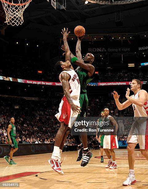 Kevin Garnett of the Boston Celtics takes the shot over Amir Johnson of the Toronto Raptors during a game on April 7, 2010 at the Air Canada Centre...