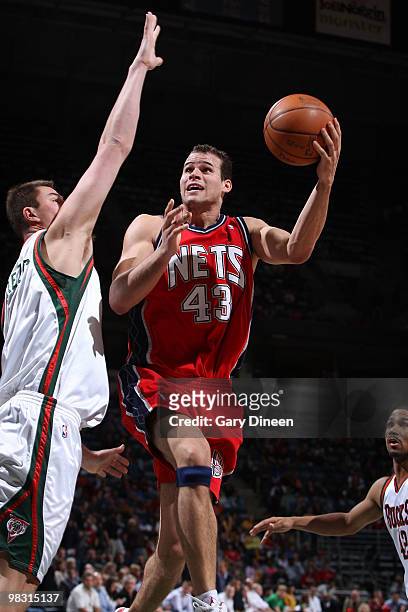 Kris Humphries of the New Jersey Nets shoots a layup against Primoz Brezec of the Milwaukee Bucks on April 7, 2010 at the Bradley Center in...
