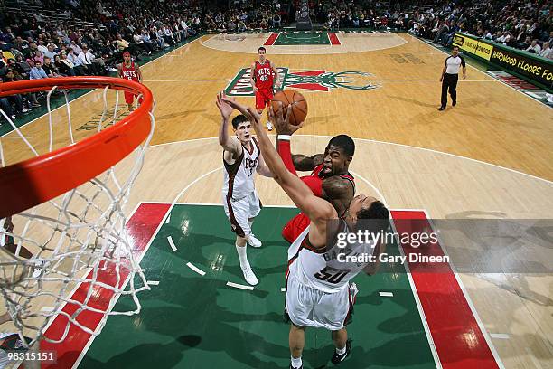 Terrence Williams of the New Jersey Nets shoots a layup against Dan Gadzuric of the Milwaukee Bucks on April 7, 2010 at the Bradley Center in...