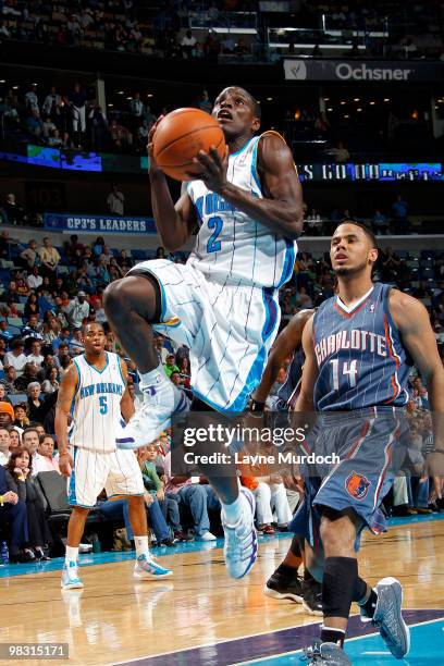 Darren Collison of the New Orleans Hornets shoots over D.J. Augustin of the Charlotte Bobcats on April 7, 2010 at the New Orleans Arena in New...