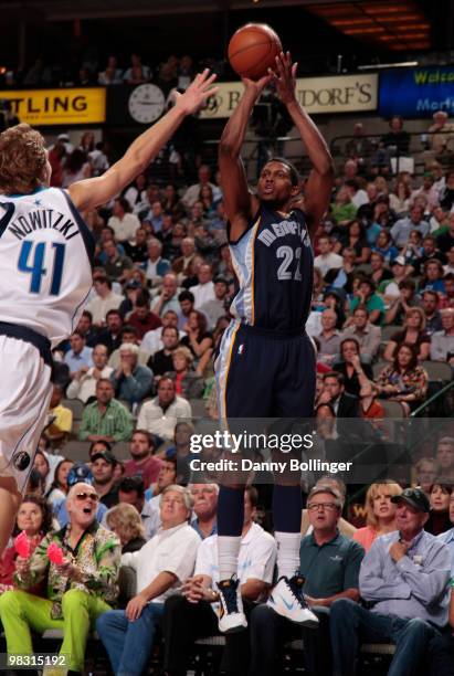 Rudy Gay of the Memphis Grizzlies shoots a jumper against Dirk Nowitzki of the Dallas Mavericks during a game at the American Airlines Center on...