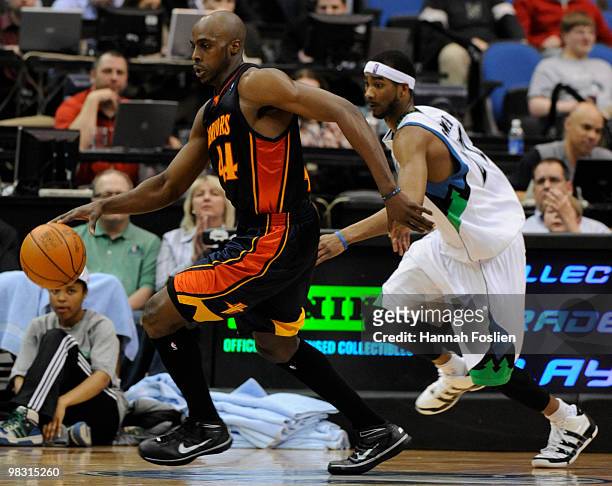 Corey Brewer of the Minnesota Timberwolves guards against Anthony Tolliver of the Golden State Warriors in the second half of a basketball game at...