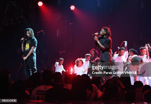 Cole and Daniel Caesar performs onstage at the 2018 BET Awards at Microsoft Theater on June 24, 2018 in Los Angeles, California.