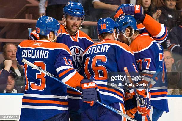 Dustin Penner of the Edmonton Oilers celebrates his first period goal with his teammates, the goal came against the Colorado Avalanche at Rexall...