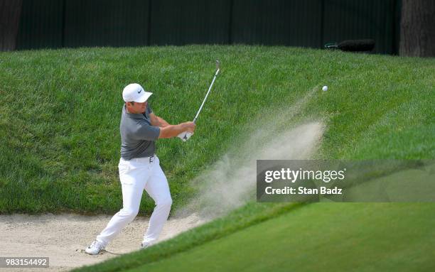 Paul Casey of England plays a bunker shot on th eighth hole during the final round of the Travelers Championship at TPC River Highlands on June 24,...