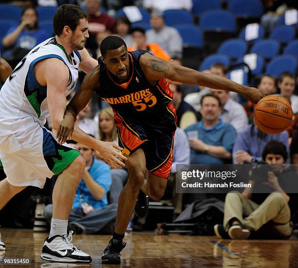 Reggie Williams of the Golden State Warriors chases a loose ball in the second first against Kevin Love of the Minnesota Timberwolves during a...