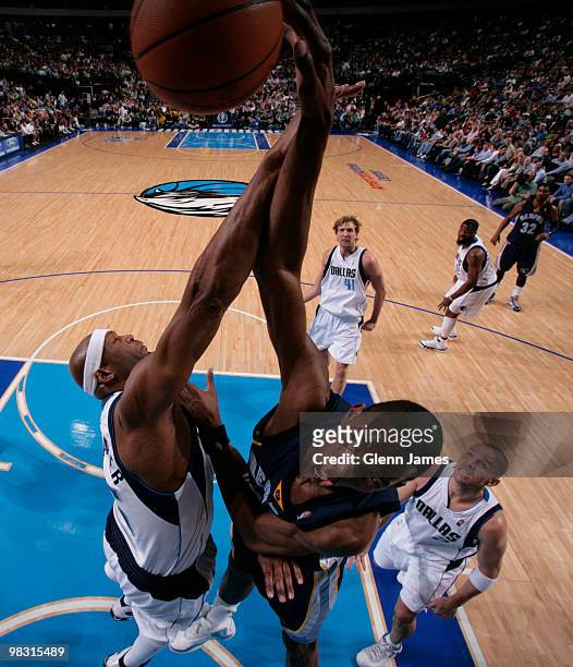 Hasheem Thabeet of the Memphis Grizzlies goes up for the dunk against Erick Dampier of the Dallas Mavericks during a game at the American Airlines...
