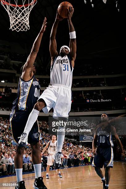 Jason Terry of the Dallas Mavericks goes in for the dunk against Darrell Arthur of the Memphis Grizzlies during a game at the American Airlines...