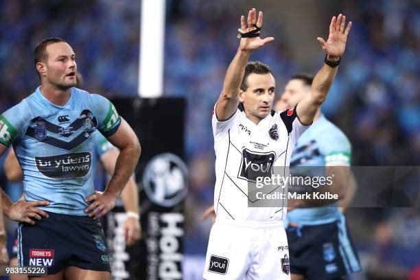 Boyd Cordner of the Blues looks dejected as referee Gerard Sutton sends James Roberts of the Blues to the sin binduring game two of the State of...