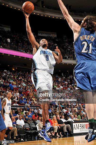 Rashard Lewis of the Orlando Magic shoots against Fabricio Oberto of the Washington Wizards during the game on April 7, 2010 at Amway Arena in...