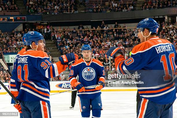 Mike Comrie, Patrick O'Sullivan and Shawn Horcoff of the Edmonton Oilers celebrate a second period goal against the Colorado Avalanche at Rexall...