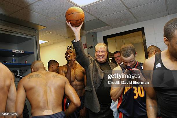 Head coach Don Nelson of the Golden State Warriors holds up the game ball in celebration of becoming the all-time NBA winningest coach with 1,333...