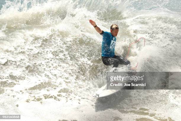 Kevin Schulz cuts back on a wave during his quarter final heat at the 2018 Shoe City Pro at the Huntington Beach Pier on June 24, 2018 in Huntington...