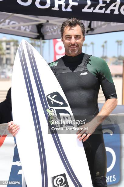 Nathan Yeomans of USA poses for a photo after winning his semi final heat at the 2018 Shoe City Pro at the Huntington Beach Pier on June 24, 2018 in...