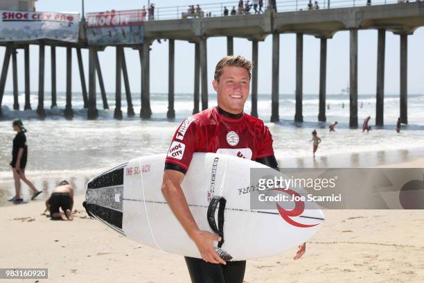 Elijah Fox exits the water after winning his semi final heat at the 2018 Shoe City Pro at the Huntington Beach Pier on June 24, 2018 in Huntington...