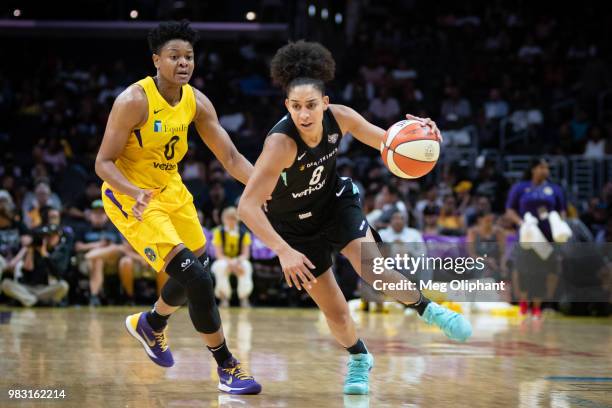 Bria Hartley of New York Liberty handles the ball defended by Alana Beard of the LA Sparks at Staples Center on June 24, 2018 in Los Angeles,...