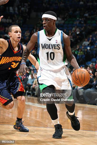 Jonny Flynn of the Minnesota Timberwolves moves the ball against Stephen Curry of the Golden State Warriors during the game on April 7, 2010 at the...