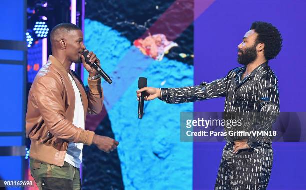 Host Jamie Foxx and Donald Glover speak onstage at the 2018 BET Awards at Microsoft Theater on June 24, 2018 in Los Angeles, California.