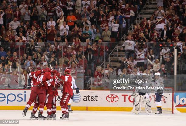 Taylor Pyatt of the Phoenix Coyotes celebrates with teammates after scoring a third period goal against goaltender Pekka Rinne of the Nashville...