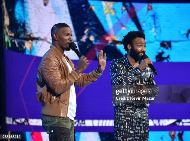 Host Jamie Foxx and Donald Glover speak onstage at the 2018 BET Awards at Microsoft Theater on June 24, 2018 in Los Angeles, California.