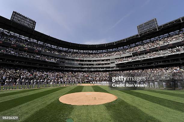 Members of the Chicago White Sox and Cleveland Indians lineup for the National Anthem prior to the game on April 5, 2010 a U.S. Cellular Field in...