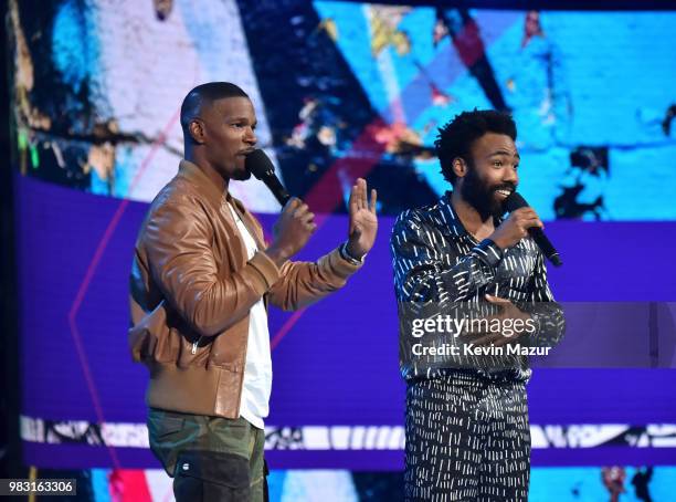 Host Jamie Foxx and Donald Glover speak onstage at the 2018 BET Awards at Microsoft Theater on June 24, 2018 in Los Angeles, California.