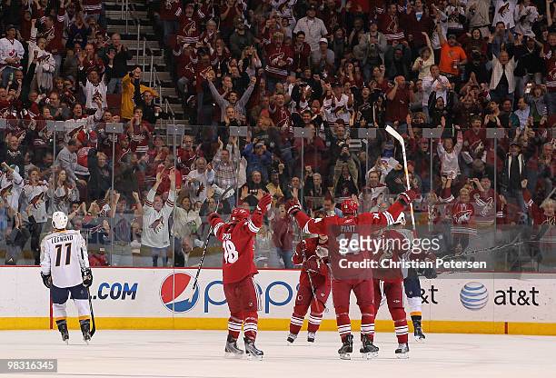 Taylor Pyatt of the Phoenix Coyotes celebrates with teammates after scoring a third period goal against the Nashville Predators during the NHL game...