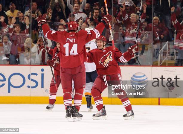 Taylor Pyatt of the Phoenix Coyotes celebrates with teammate Lee Stempniak after scoring the game-winner against the Nashville Predators on April 7,...