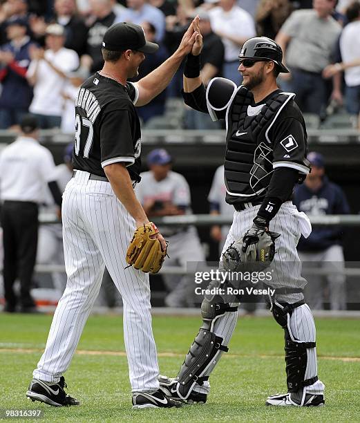 Matt Thornton celebrates with A.J. Pierzynski of the Chicago White Sox after the game against the Cleveland Indians on April 5, 2010 at U.S. Cellular...