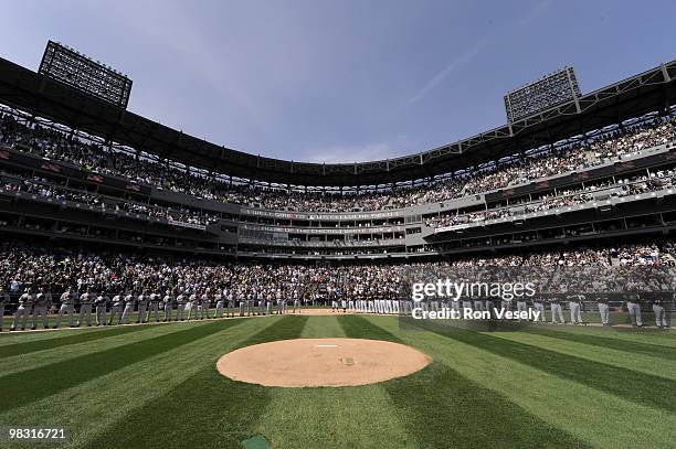 Members of the Chicago White Sox and Cleveland Indians lineup for the National Anthem prior to the game on April 5, 2010 a U.S. Cellular Field in...