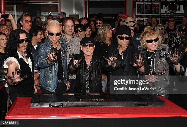 Pawel Maciwoda, Rudolf Schenker, Klaus Meine, Matthias Jabs, James Kottak of The Scorpions are inducted into the Hollywood RockWalk on April 6, 2010...