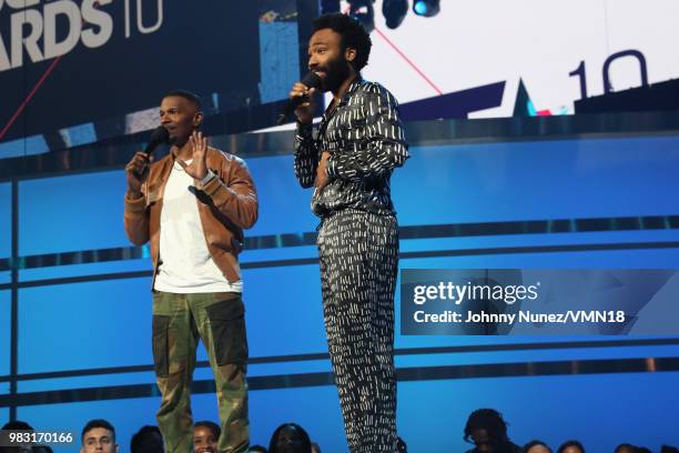 Host Jamie Foxx and Donald Glover speak onstage at the 2018 BET Awards at Microsoft Theater on June 24, 2018 in Los Angeles, California.