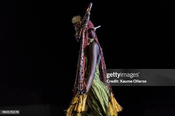 Model walks the runway during Ousmou Sy show on last day of the Dakar Fashion Week at the working class suburb of Keur Massar on June 24, 2018 in...