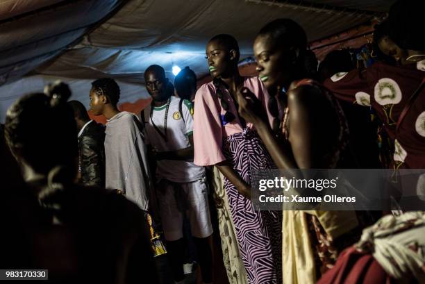 Models get ready ahead of the final day of the Dakar Fashion Week at the working class suburb of Keur Massar on June 24, 2018 in Dakar, Senegal.