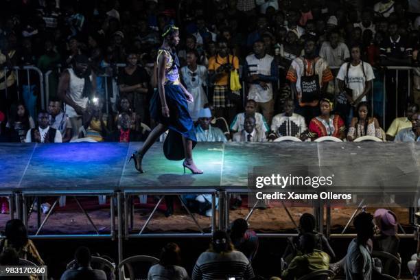 Model walks the runway during Bimou Cration show on last day of the Dakar Fashion Week at the working class suburb of Keur Massar on June 24, 2018 in...