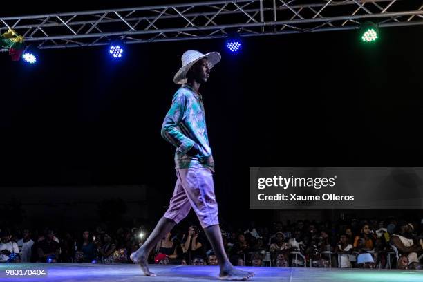 Model walks the runway during Bod'J show on last day of the Dakar Fashion Week at the working class suburb of Keur Massar on June 24, 2018 in Dakar,...