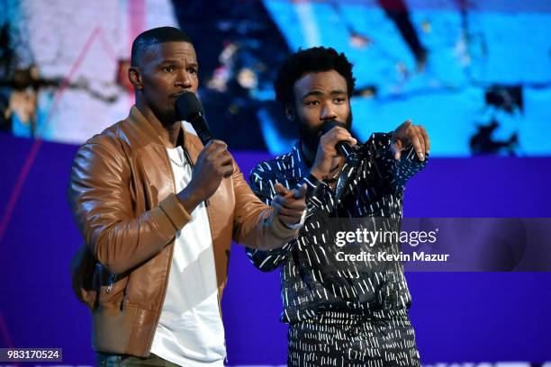 Host Jamie Foxx and Donald Glover speak onstage at the 2018 BET Awards at Microsoft Theater on June 24, 2018 in Los Angeles, California.