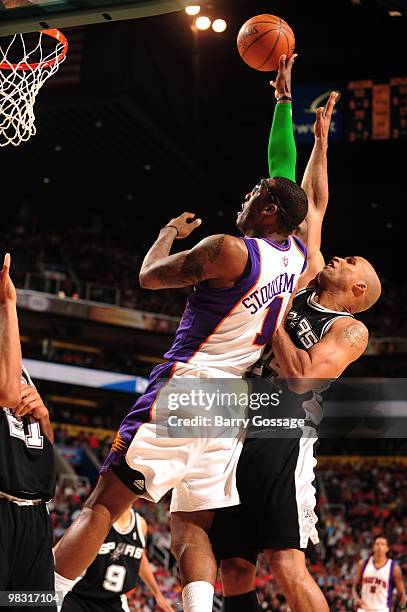 Richard Jefferson of the San Antonio Spurs tries to block the shot of Amare Stoudemire of the Phoenix Suns in an NBA Game played on April 7, 2010 at...