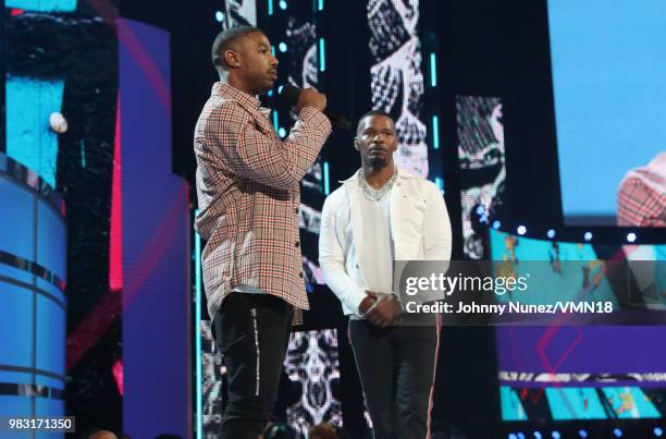 Michael B. Jordan and host Jamie Foxx speak onstage at the 2018 BET Awards at Microsoft Theater on June 24, 2018 in Los Angeles, California.