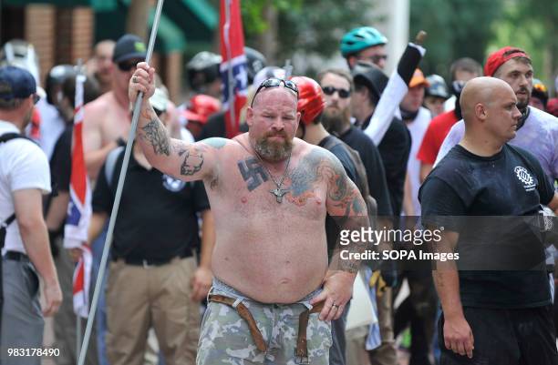 White supremacist man is seen holding a long pipe during the State of Emergency. White supremacists gathered at Emancipation Park in Charlottesville,...